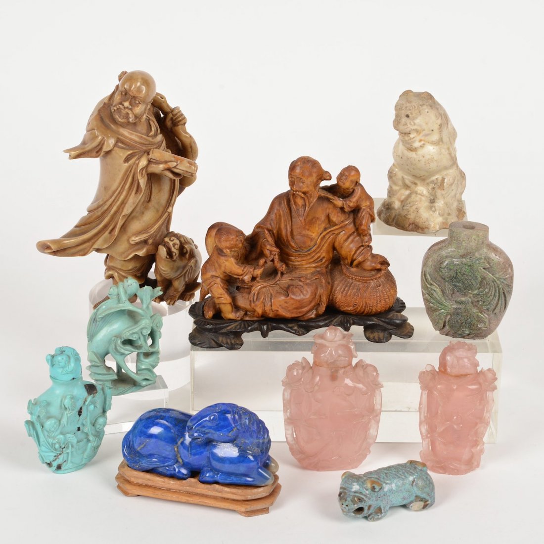 Group Chinese pottery and hardstone carvings: Group Chinese pottery and hardstone carvings, 19th/20th c., (10) pieces, incl. a lapis horse on hardwood stand, 2 soapstone figure groups, flambe glazed porcelain dog, etc., 3.5"h x 4.25"w x 1.75"d (l