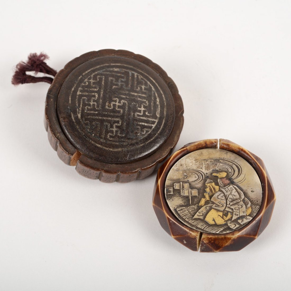 (2) Japanese Kagamibuta netsuke: (2) Japanese Kagamibuta netsuke, 19th/20th c., Shinto priest and geometric line design, 1.5"dia. and 1.75"dia.