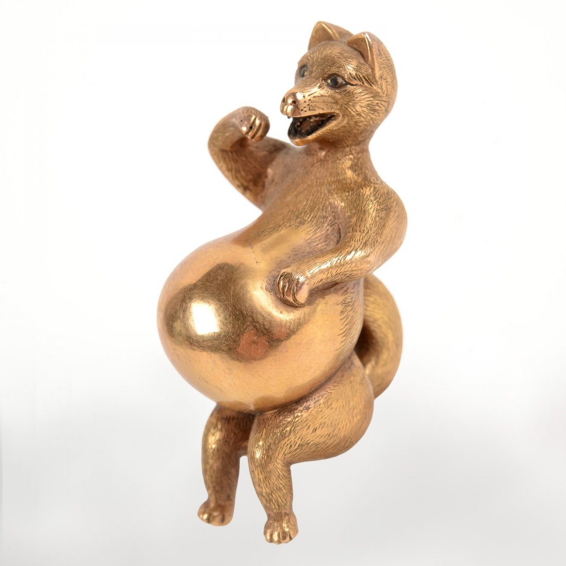 Japanese gold model of Tanuki: Japanese gold model of Tanuki, 19th c., possibly a netsuke, standing pose with distended belly, 2.25"h, approx. 24.4 dwt.