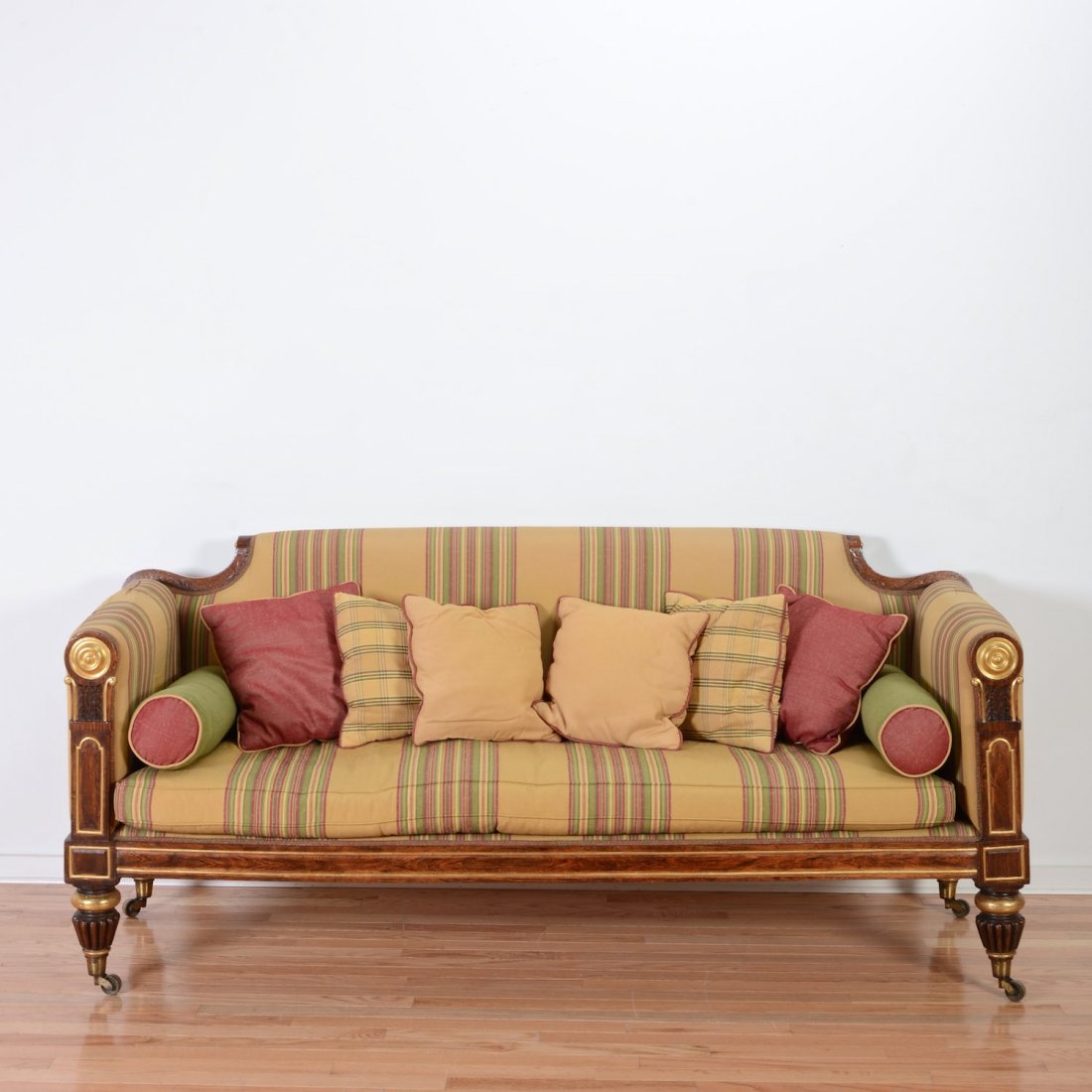 Nice William IV parcel gilt carved rosewood sofa: Nice William IV parcel gilt carved rosewood sofa, 19th c., in the manner of Gillows, paneled arm supports with gilt roundels, 36"h x 77"l x 27"d