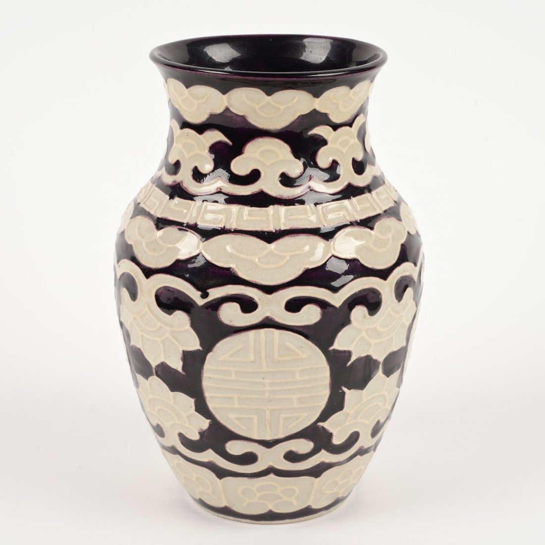 Japanese Kairakuen ware porcelain vase: Japanese Kairakuen ware porcelain vase, Meiji Period, four-character mark on underside of foot, aubergine glaze with lotus design, 8"h x 5.75"dia.