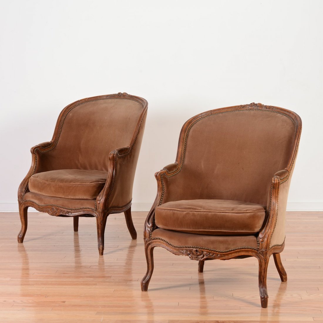 Pair large Louis XV style beechwood bergeres: Pair large Louis XV style beechwood bergeres, 19th/20th, brown velvet seating, 37.25"h x 28"w x 32.5"d