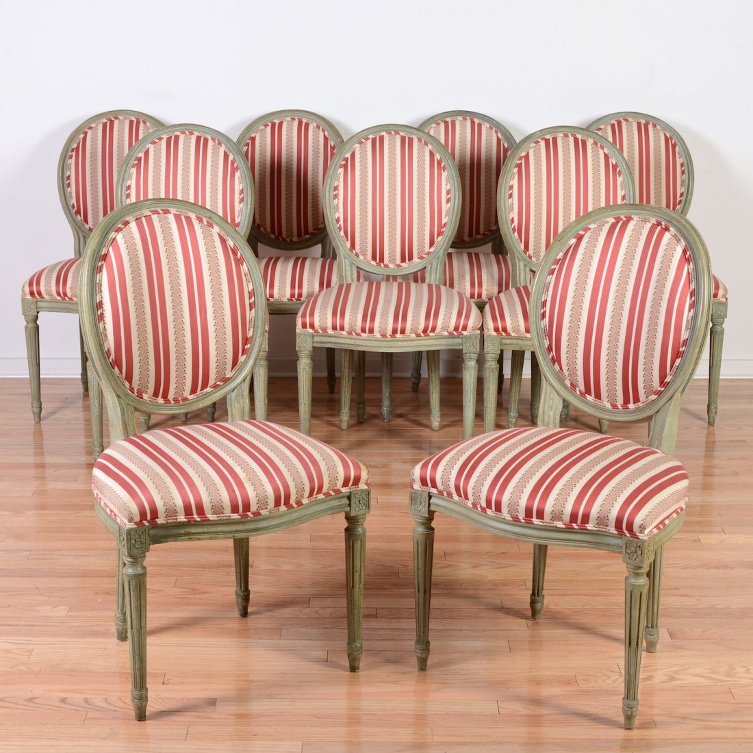 Set (9) Baker Louis XVI style green painted dining: Set (9) Baker Louis XVI style green painted dining chairs, 20th c., red striped silk seating, metal factory tags, 34.5"h x 21"w x 17"d