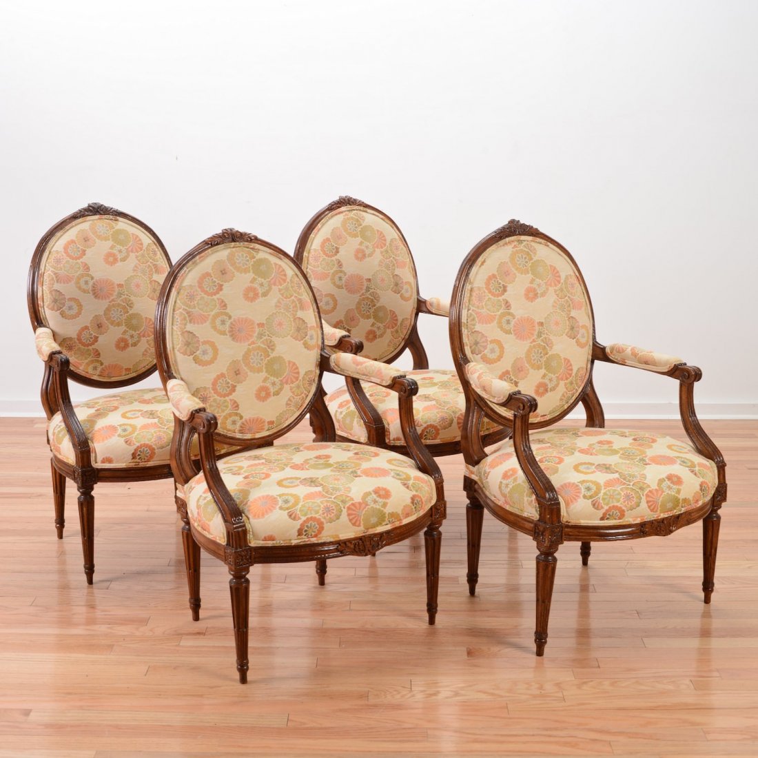 Set (4) Louis XVI carved beechwood fauteuils: Set (4) Louis XVI carved beechwood fauteuils, 19th c., oval backrests, sharply tapered stop-fluted legs, each marked "D" on seat rail, 38.5"h x 24"w x 22"d