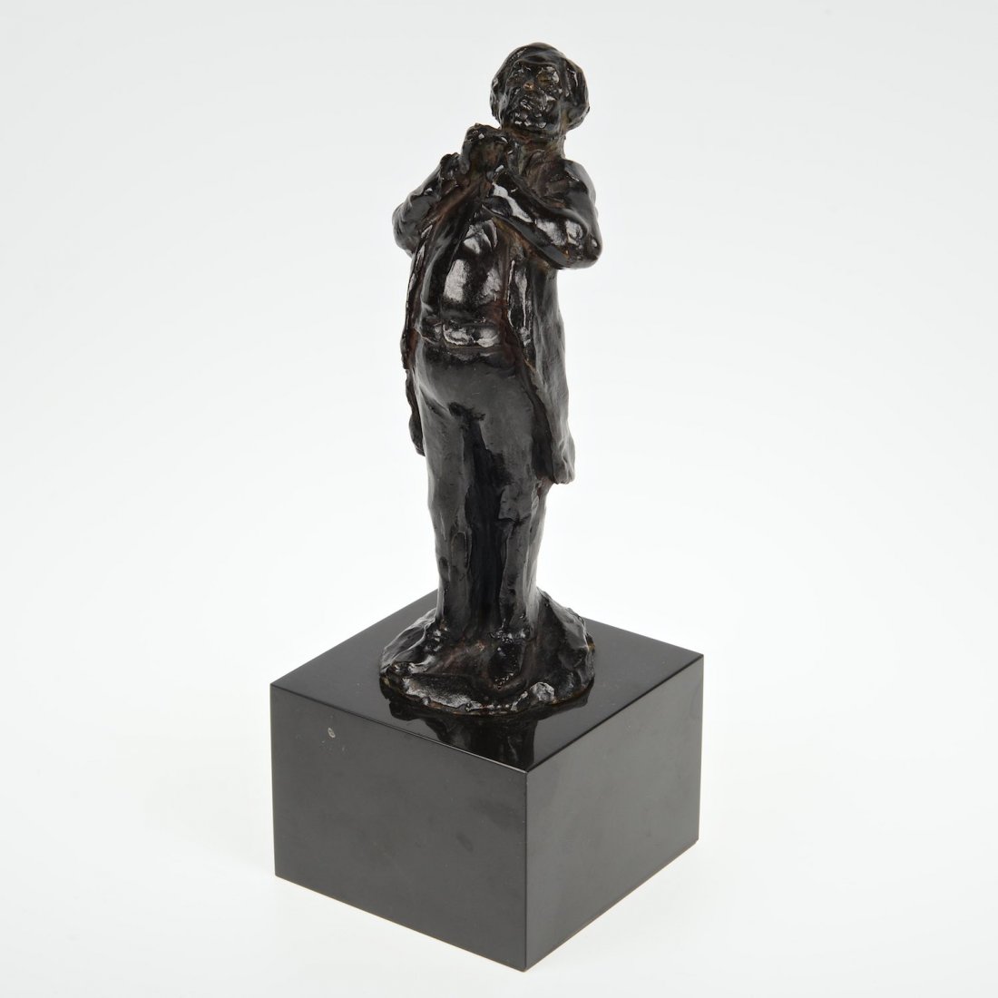After Honore Daumier (1808-1879, French), sculpture: After Honore Daumier (1808-1879, French), sculpture, Standing gent fixing his collar, bronze with dark brown/black patina, inscribed "hD", foundry seal "C. Valsuani Cire Perdue", on black marble base,
