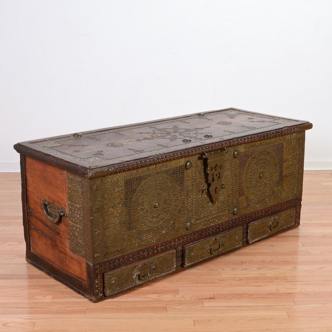 Dutch Colonial brass mounted hardwood trunk: Dutch Colonial brass mounted hardwood trunk, 17th/18th c., brass tack and punched sheet brass decoration, 24"h x 57.5"w x 24.5"d