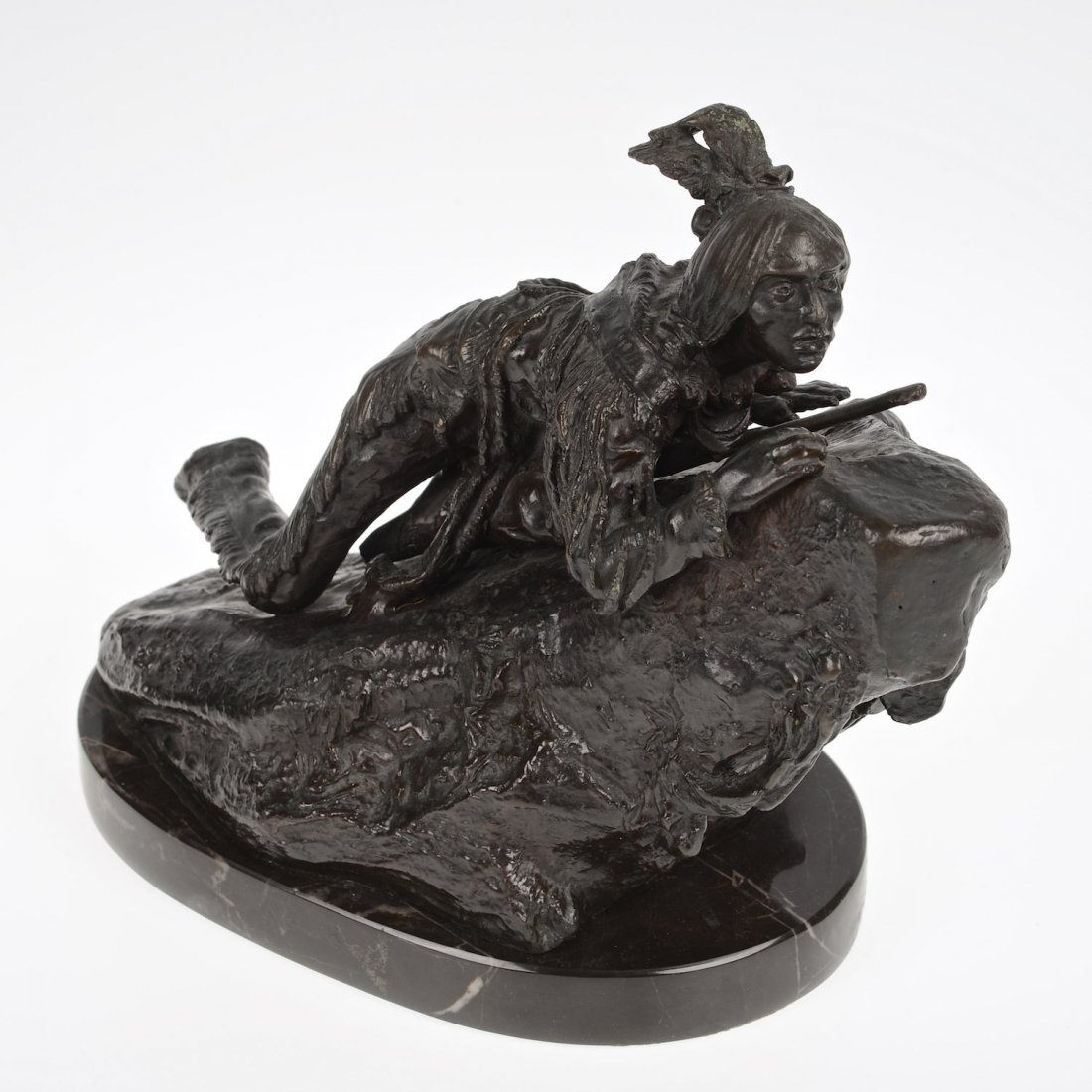 After Carl Kauba (1865-1922, Austrian), sculpture: After Carl Kauba (1865-1922, Austrian), sculpture, Indian scout, bronze with brown patina, inscribed "C. Kauba" and "Geschutzt", on marble base, 7.5"h x 8.5"l x 4.5"w Provenance: from the Estate of Ed