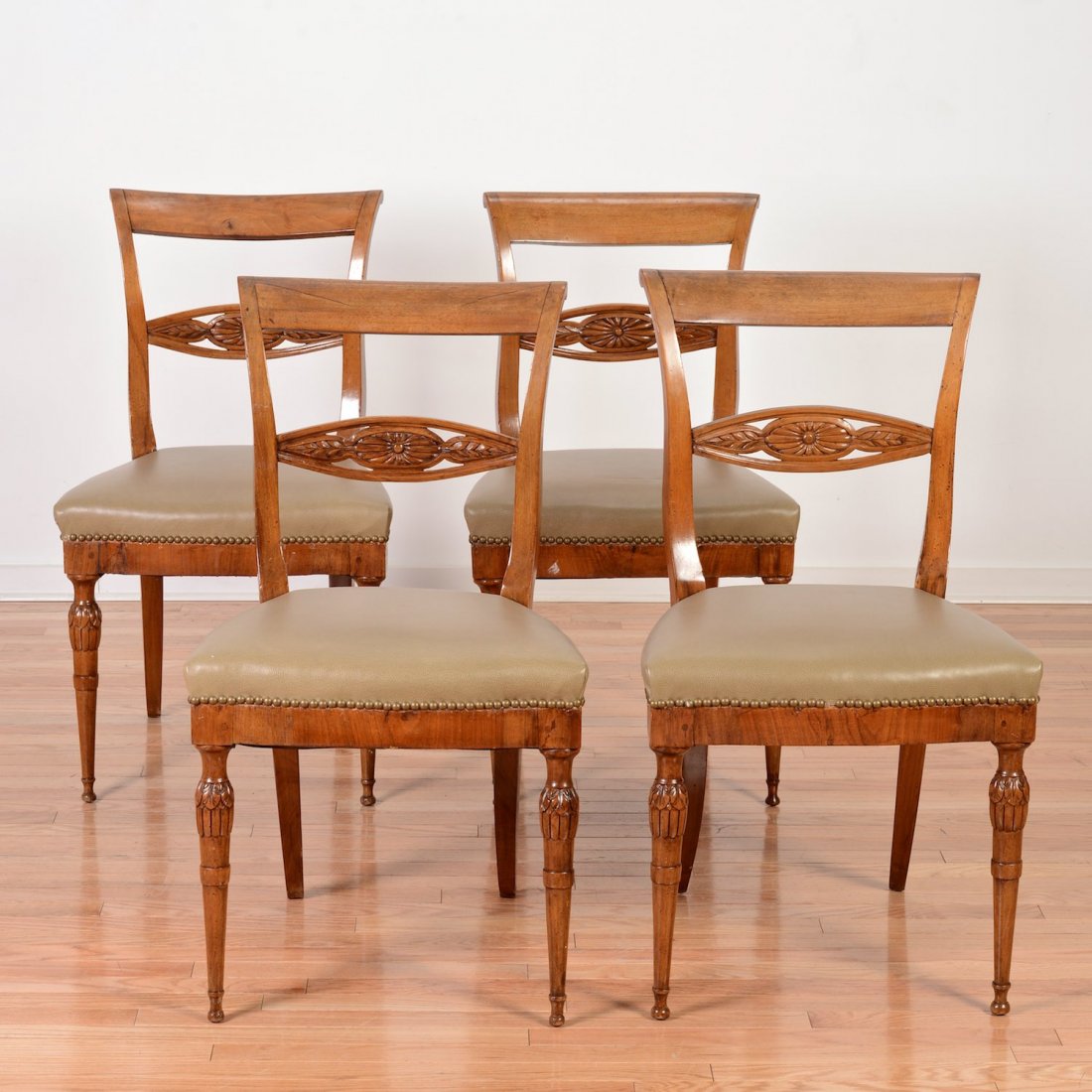 Set (4) Italian Neo-Classical fruitwood side chairs: Set (4) Italian Neo-Classical fruitwood side chairs, 19th c., taupe leather seats, 34.5"h x 20"w x 18"d Provenance: from the Estate of Edgar M. Bronfman, New York, NY