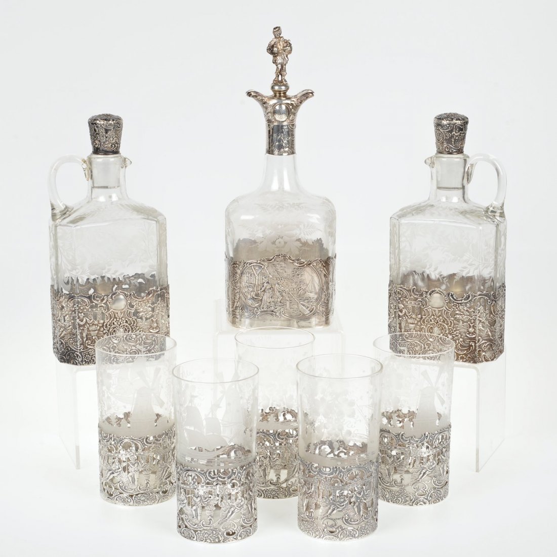 Group German style silver and etched glass barware: Group German style silver and etched glass barware, 20th c., (8) pcs., incl. (2) matched decanters, mark of Edward Ball Co., NY; (5) glasses retailed by S. Wyler, Inc., NY; and (1) English decanter bo