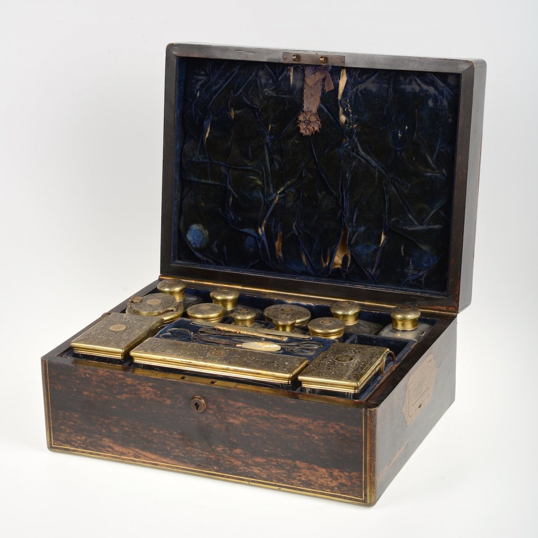 Victorian silver fitted calamander traveling toilet: Victorian silver fitted calamander traveling toilet case, London, circa 1848, maker's marks "CR-WS", retailed by Hunt & Roskell, Jewelers to the Queen, London, fitted interior with gilt silver mounted