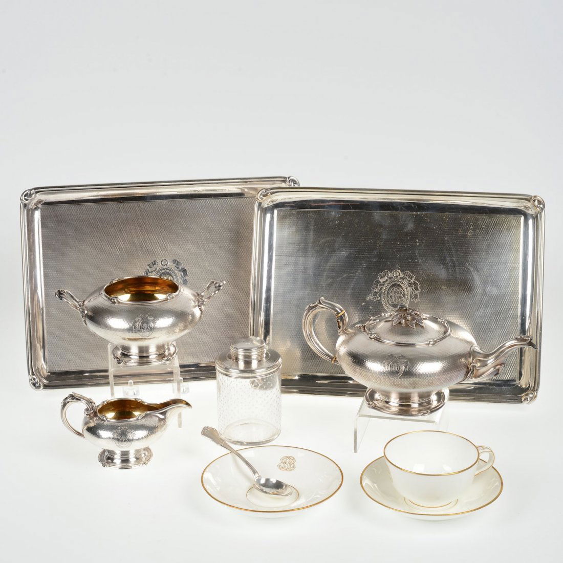 Napoleon III silver traveling tea set: Napoleon III silver traveling tea set, 19th c., retailed by Attcoc Aine, incl. (1) teapot, (1) sugar bowl, (1) creamer, (1) teaspoon, (1) tea caddy, (2) silver plated trays, (1) porcelain teacup and (