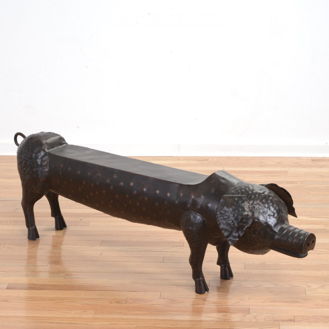 Decorator patinated metal pig bench (1 of 3)