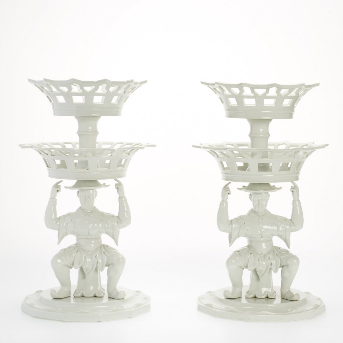 Pr. Mottahedeh blanc de chine "Mandarin" epergnes: Pr. Mottahedeh blanc de chine "Mandarin" epergnes, 20th c., two-tiered baskets above male figural base, marked "VA Portugal", to underside, 21.5"h x 12"dia.