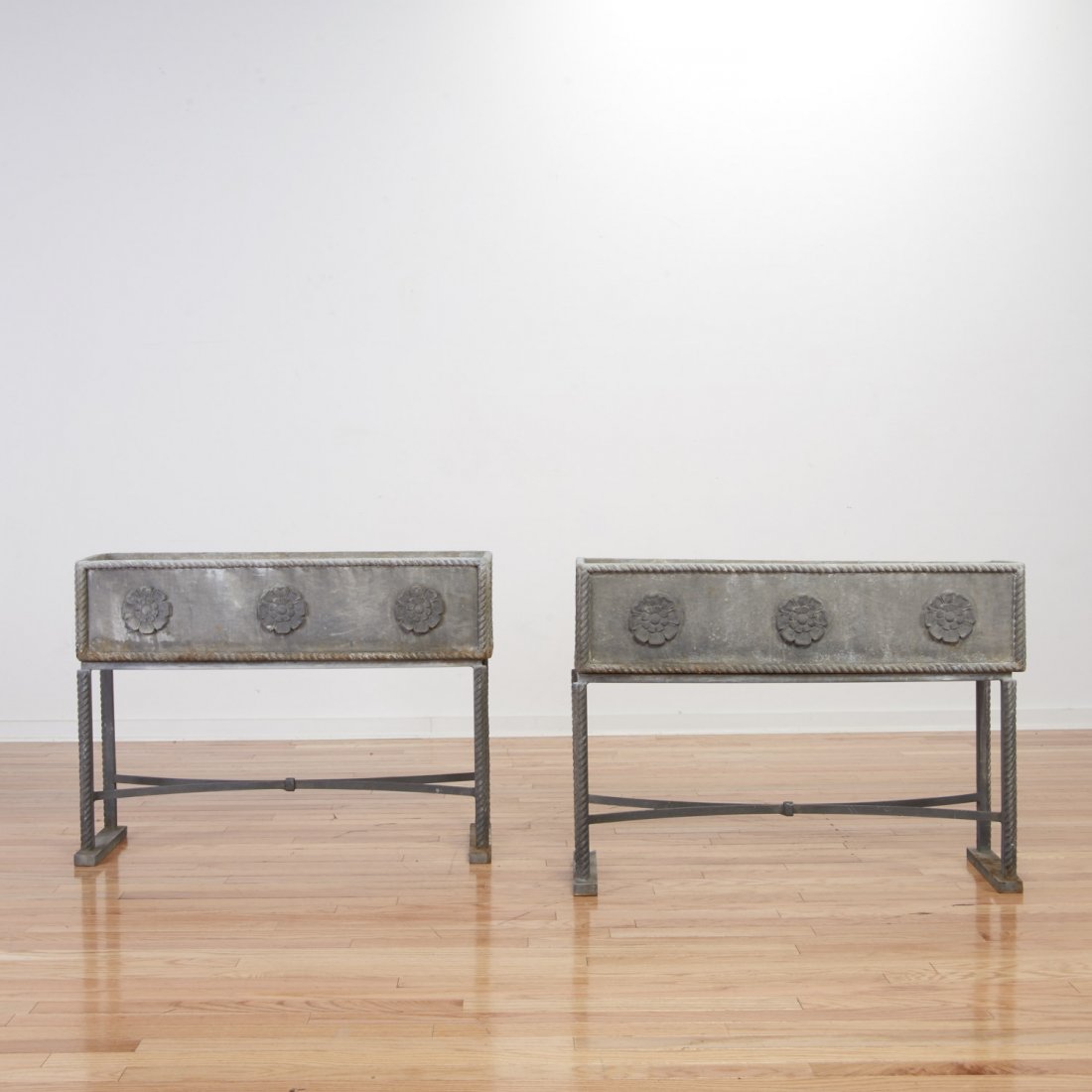 Pair lead jardinieres manner of Arbus: Pair lead jardinieres manner of Arbus, 20th c., in 2 parts, rectangular in shape on rope twist stands, 27"h x 36"w x 9"d (total) Provenance: The Estate of Edgar M. Bronfman, NY