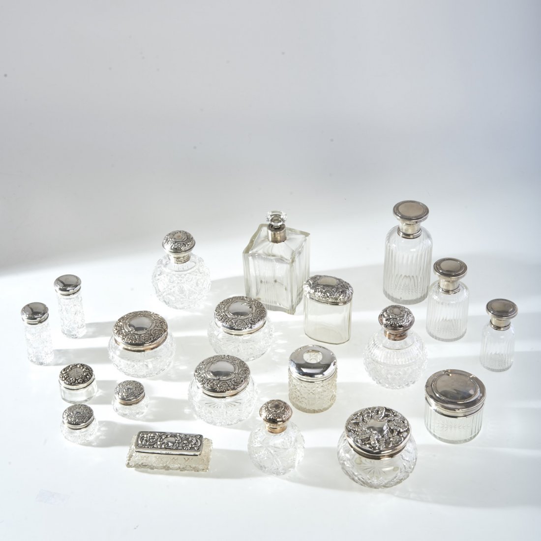 Collection (20) sterling and cut glass accessories: Collection (20) sterling and cut glass accessories, 19th and 20th c., English and American examples incl. Carr Sterling, 6"h x 2.75"dia. (largest), 1.5"h x 2"dia. (smallest)