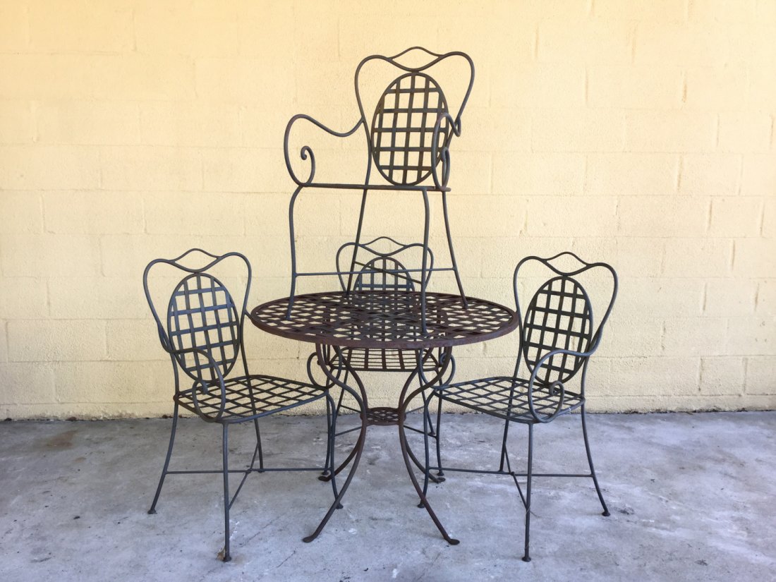 (4)-piece wrought iron dining suite: (4)-piece wrought iron dining suite, 20th c., 36"h x 18.25"w x 19"d (chairs), 29"h x 36"dia. (table)