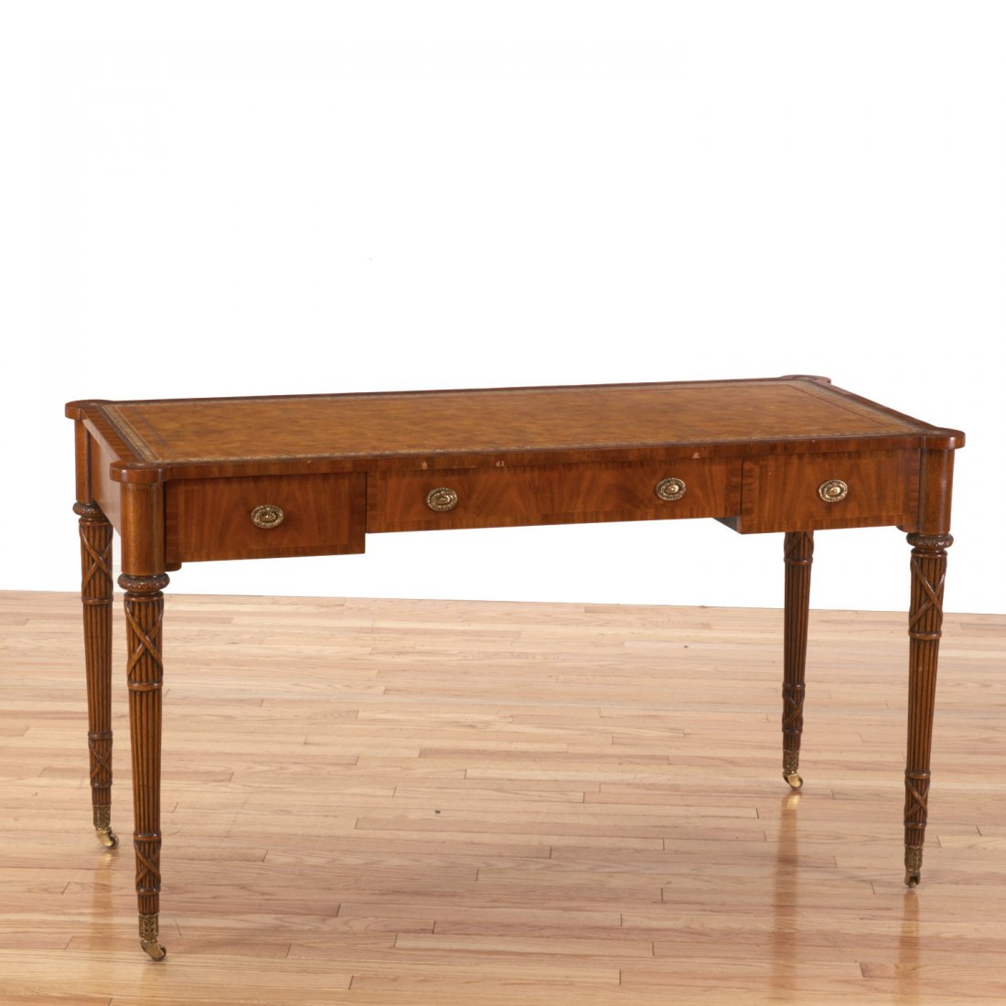 Maitland Smith leather inset mahogany writing desk: Maitland Smith leather inset mahogany writing desk, 20th/21st c., 29.5"h x 52.25"w x 24"d Provenance: Property from a major corporate collection, NY