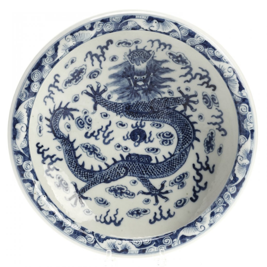 Chinese blue and white porcelain dragon dish: Chinese blue and white porcelain dragon dish, 19th/20th c., underglaze blue Kangxi marks, 3"h x 10.25"dia.