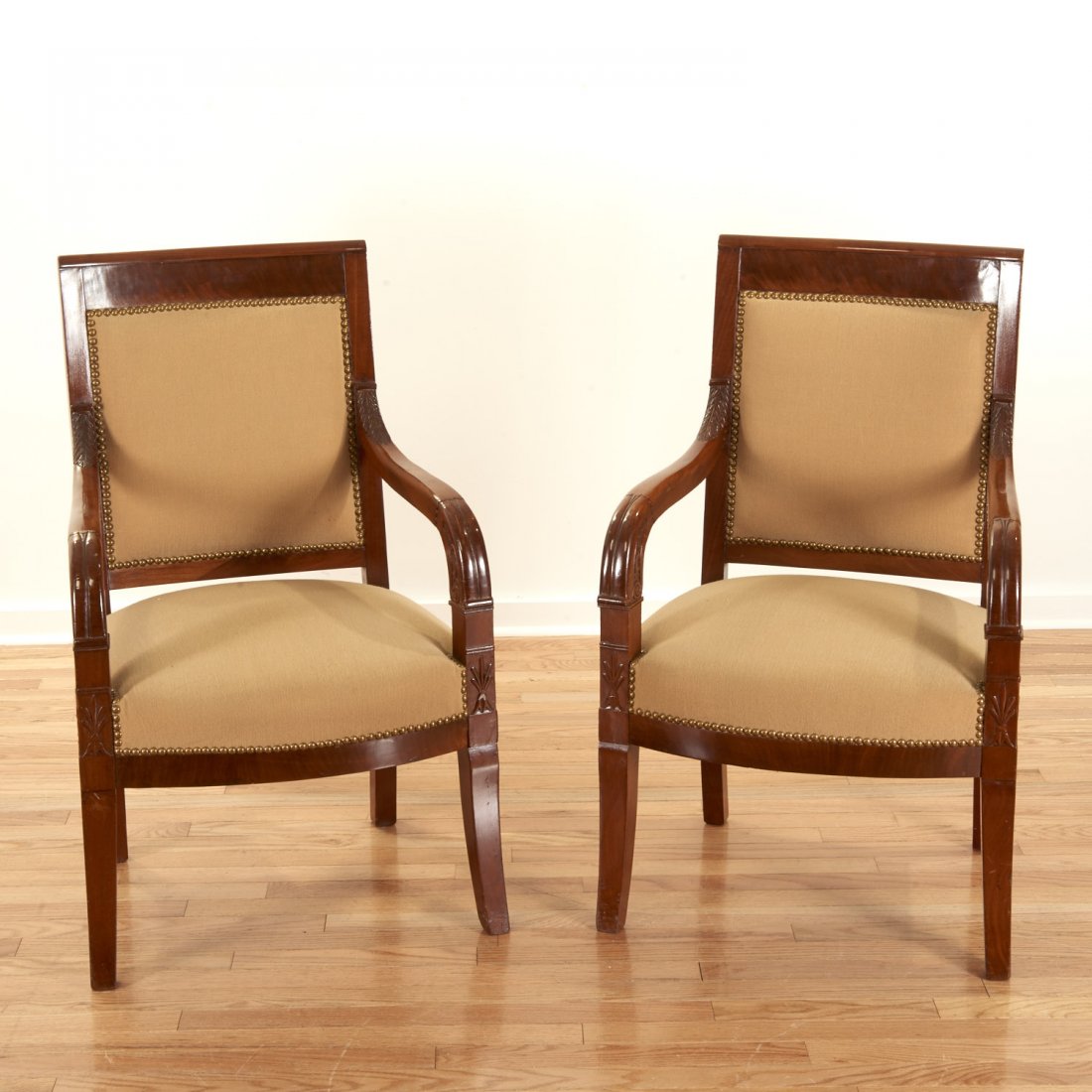 Pair Restauration style mahogany armchairs: Pair Restauration style mahogany armchairs, 19th/20th c., beige closed-nail upholstery, 36.5"h x 22"w x 18"d