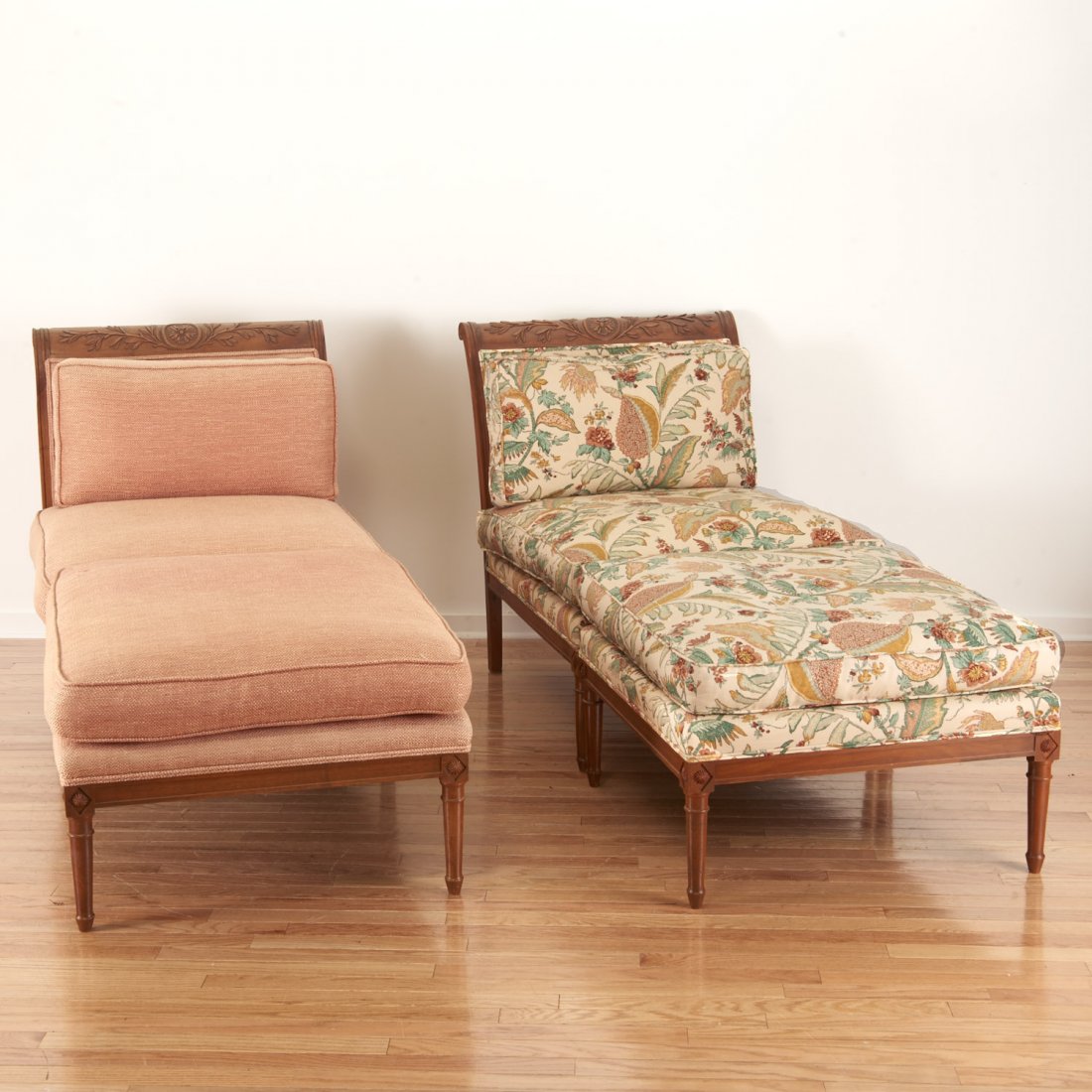 Pair Neo-Directoire upholstered walnut chauffeuse: Pair Neo-Directoire upholstered walnut chauffeuse, 19th/20th c., with a later reproduction ottoman, 36"h x 30"w x 34"d (chairs), 20"h x 30"w x 29"d (ottoman) Provenance: Property from a Rye, NY Estate