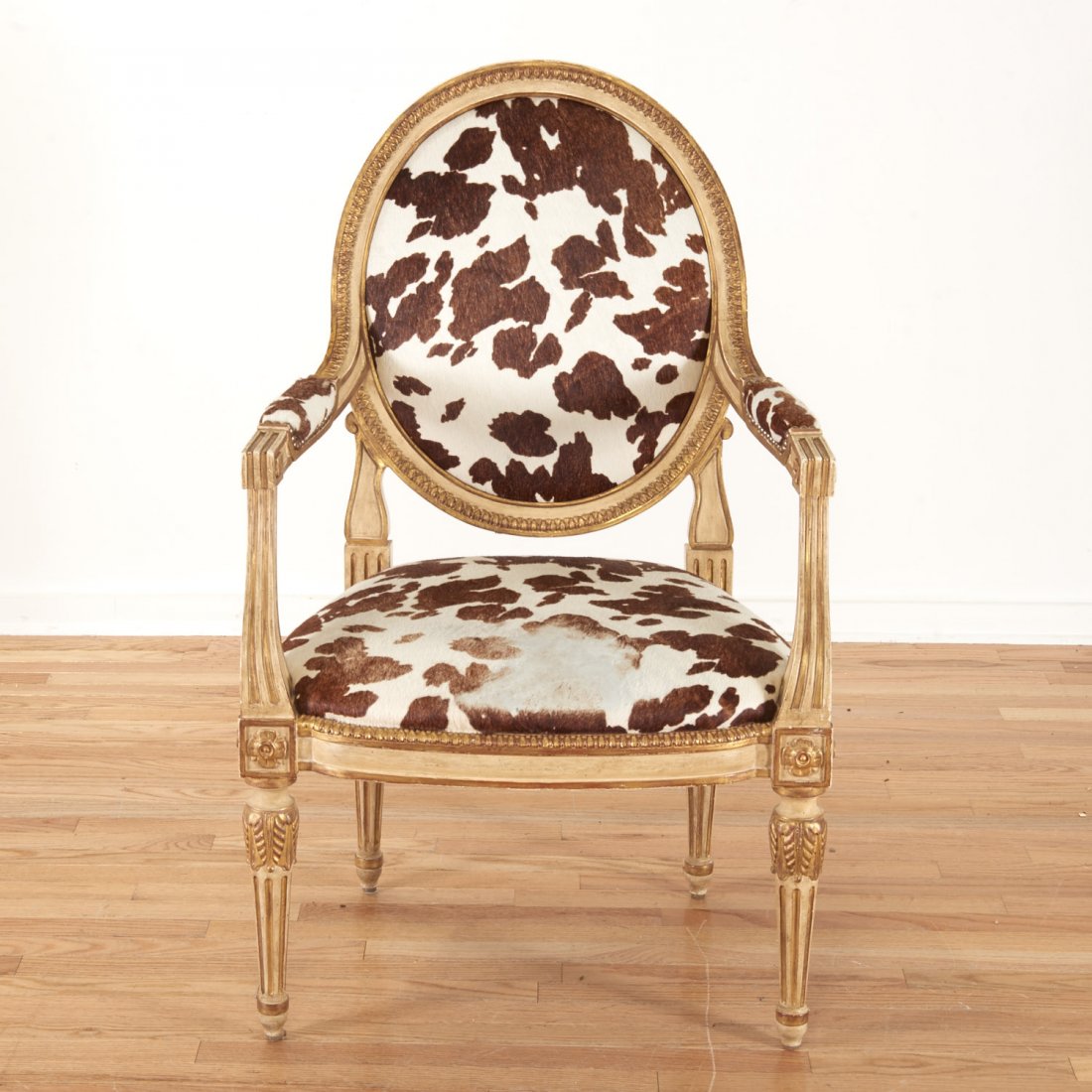 Louis XVI style cowhide fauteuil by Dennis & Leen: Louis XVI style cowhide fauteuil by Dennis & Leen, 20th c., 41.5"h x 26.25"w x 20.5"d Provenance: Property from the Estate of a NY Financier