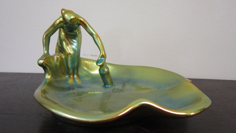 VINTAGE ZSOLNAY EOSIN DECO STYLE TRAY: VINTAGE ZSOLNAY EOSIN DECO STYLE TRAY Measures Approximately 4" Tall by 6" Wide. Depicting Woman Taking water from Pond. Signed to Base Zsolnay. 224.1grams