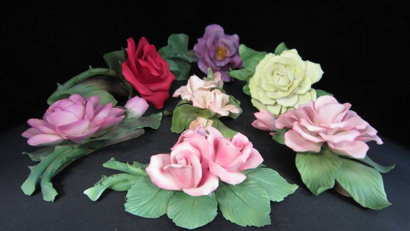 COLLECTION OF SEVEN CAPODIMONTE FLOWERS: COLLECTION OF SEVEN CAPODIMONTE FLOWERS Each Measures Approximately 7" Long, All Different Styles and Colors. Circa Mid Century. Total Weight 1400grams