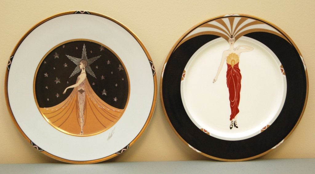 PAIR OF LARGE ERTE PORCELAIN CHARGERS: PAIR OF LARGE ERTE PORCELAIN CHARGERS Each Charger Measures Approximately 12" in Diameter. One by Seven Arts Limited, who Has Rights to Erte Products, One by Le Soleil. Weighs 1700grams