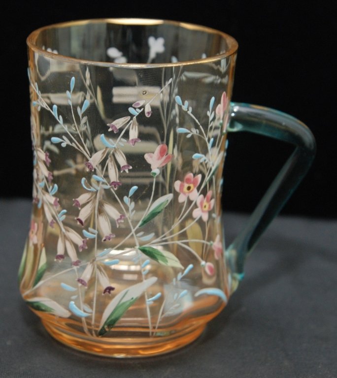 ANTIQUE MOSER ENAMELED CUP: Measures Approximately 3-3/4" Tall. amber Color with Enameled Floral Design Applied. Light Blue Handle with Antique Gold Trim. Early to Mid 20th Century. 140gms