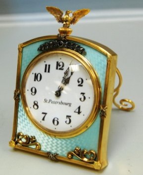 RUSSIAN GUILLOCHE SILVER ST PETERBOURG CLOCK: Russian Silver After Faberge Clock Mint Green Enameled Surface with White Porcelain Face with Diamonds. Russian Federation Eagle on Top. Measurements are 4.5" Tall by 3" Wide. Weights: 283.4 Grams.