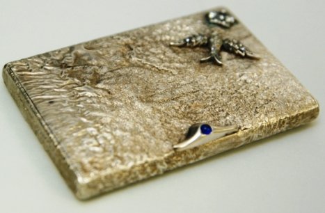 STERLING SILVER CIGARETTE CASE ROSE DIAMONDS: Russian Silver cigarette case. Engraved with Diamond Imperial Crown, and Diamond Eagle. Comes with cabochon-set sapphire thumb piece. This type of silver is known as Samorodok. It comes with Faberge B