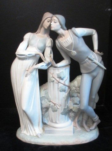 LLADRO LARGE MAN AND WOMAN LEANING ON COLUMN Large: LLADRO LARGE MAN AND WOMAN LEANING ON COLUMN Large Lladro Sculpture of a Man and Woman leaning on Column. Matte finish romantic style figures are set in 16th Century Spain.Measures 17.5" Tall by 13" L