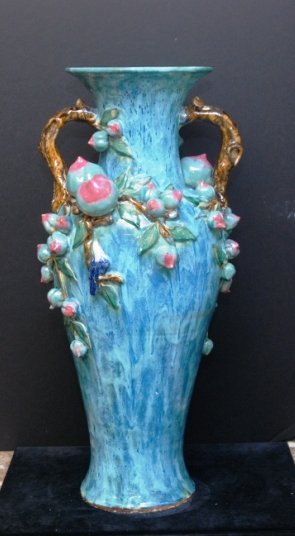 CHINESE LARGE CULTURAL VASE BIRDS AND PLUMS: Large Cultural Vase Birds Plums Glazed Porcelain Vase vibrant colors of Blue, Green, Purple, and Brown. Handles are shaped like Tree Trunks large thick Plums surround vase. Measures 29" Tall by 17" Wi