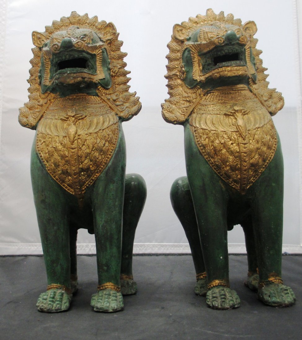 PAIR OF BRASS CHINESE FOO DOGS: PAIR OF BRASS CHINESE FOO DOGS Brass Chinese Foo Dogs with elaborate Head Dresses. Measures 10 3/4" Tall