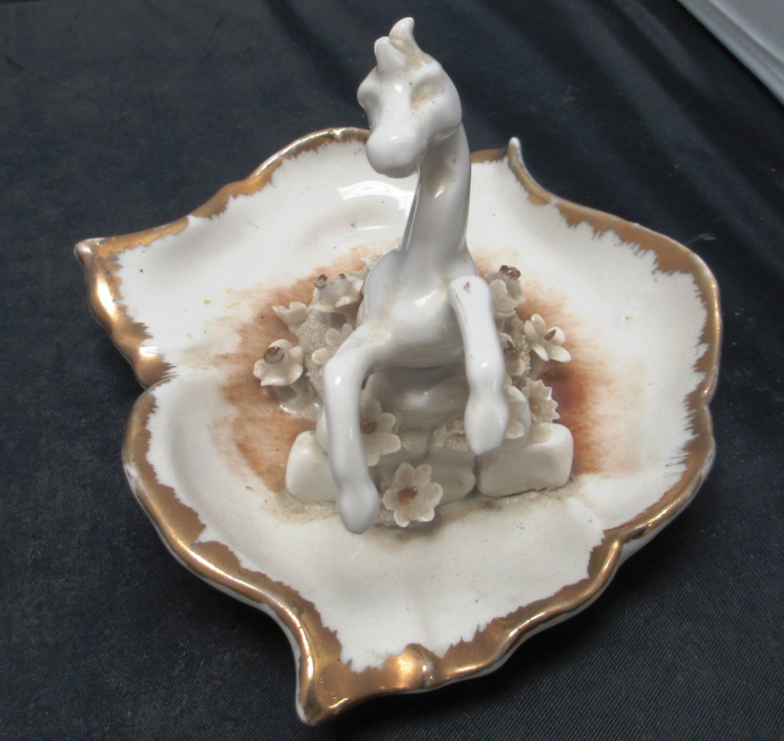 CAPODIMONTE PORCELAIN FLORAL & HORSE ASHTRAY: CAPODIMONTE PORCELAIN FLORAL & HORSE ASHTRAY Beige and Gold Toned Floral with Horse design Ashtray. Measures 6 1/2' Long by 4 1/2" Tall