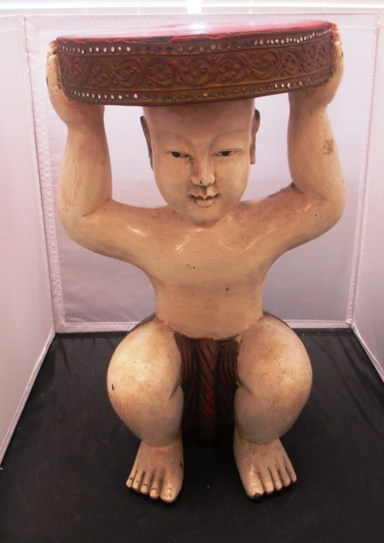 HAND CARVED STOOL OF BOY KNEELING: HAND CARVED STOOL OF BOY KNEELING Hand Painted Hand Carved Stool of Boy Kneeling holding up Base. Measures 19" Tall Colors of Beige Gold with Red Seat.