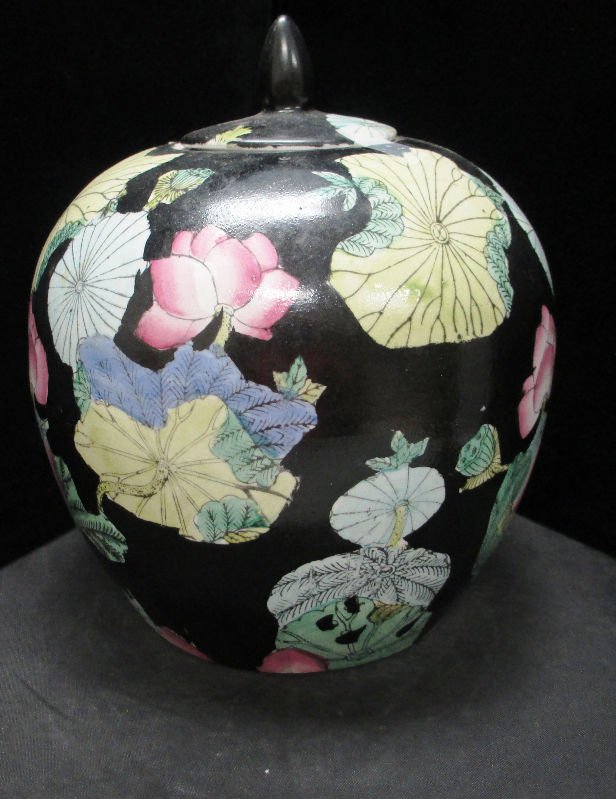 CHINESE PORCELAIN GINGER JAR: Large Black, Yellow, Pink, and Green Ginger Jar. Floral design measures 10 1/2" Tall comes with original lid. Weights 1912.5 Grams