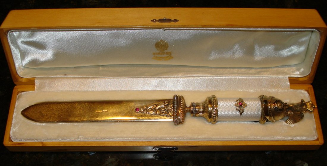 RUSSIAN SILVER PAPER KNIFE W/ HELMET DOUBLE EAGLE: Russian silver white guilloche enamel letter opener with WITH HELMET DOUBLE EAGLE HANDLE. Has cabochon stone and diamonds Marked and stamped. Includes fitted presentation box. Measures 10" long.