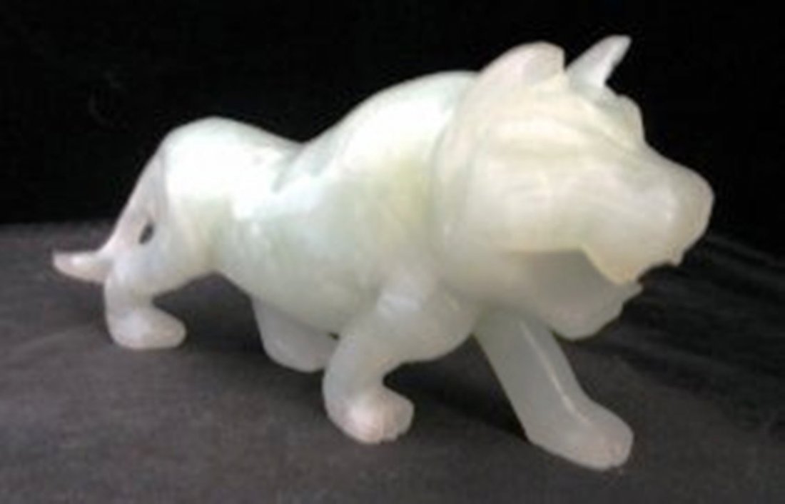CHINESE JADE FOO DOG: Chinese green jade guardian fu loin. length 5 in. 2 1/2" Tall. Weights 174.9 Grams