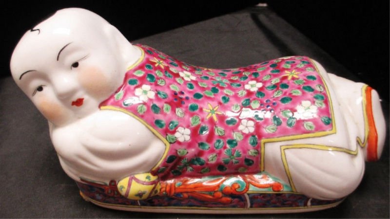 CHINESE PORCEALAIN PILLOW BOY STATUE: Pillow Boy lounging on bed in Floral robe. Measures 9" Long weights 672.9 Grams.