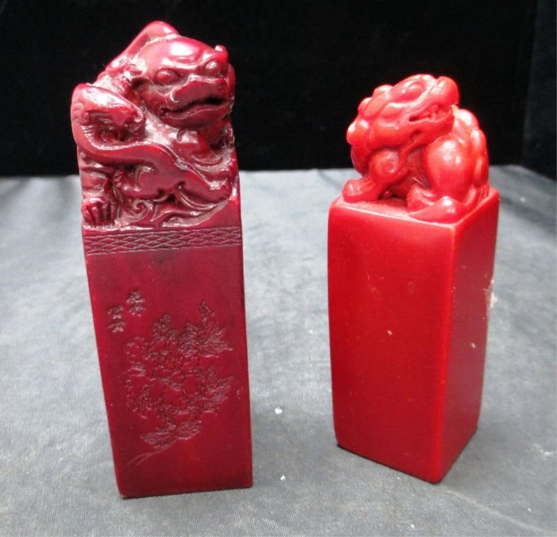 2 CHINESE SQUARE CARVED FOO DOG FIGURES: Square block of Hard Stone with Foo Dog carved on top. Deep Red Carving measures 4 1/2" Tall comes with Calligraphy and engraved floral motif weights 301.8 Grams. Additional Square Foo Dog Carving mea