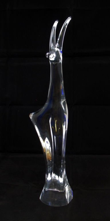 DAUM CLEAR GLASS ANTELOPE SCULPTURE SIGNED DAUM: Depicting clear glass Antelope signed 'Daum measures 14" H, circa 20th century Sleek beautiful Sculpture in excellent condition..