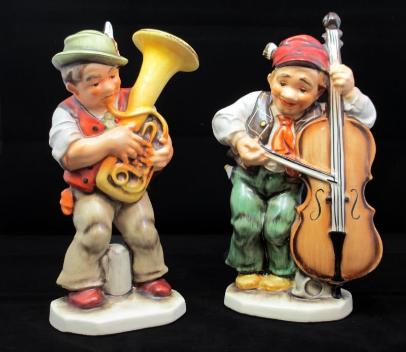 LOT OF 2 WEST GERMAN PORCELAIN FIGURINES: Bavarian Man dressed in Village clothes playing musical instrument measures 10" tall, and German man playing Musical instrument measures 11 1/2' Tall. Both Figures are stamped on bottom West Germany