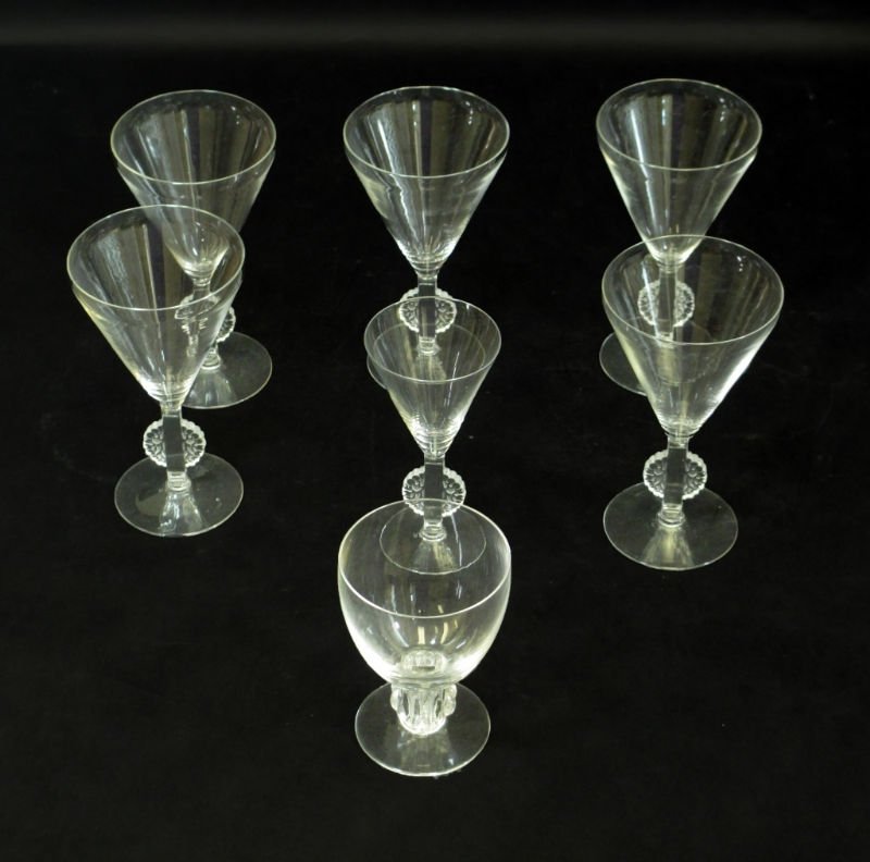 7 R LALIQUE CHAMPAGNE GLASSES: Signed R Laliqe France on Bottom Stem has Floral Leaf Pattern all Glasses are in excellent condition measures 5 3/4" Tall by 3" Diameter plus 1 Liquor Glass same pattern measures 5" Tall by 2 1/2" Dia