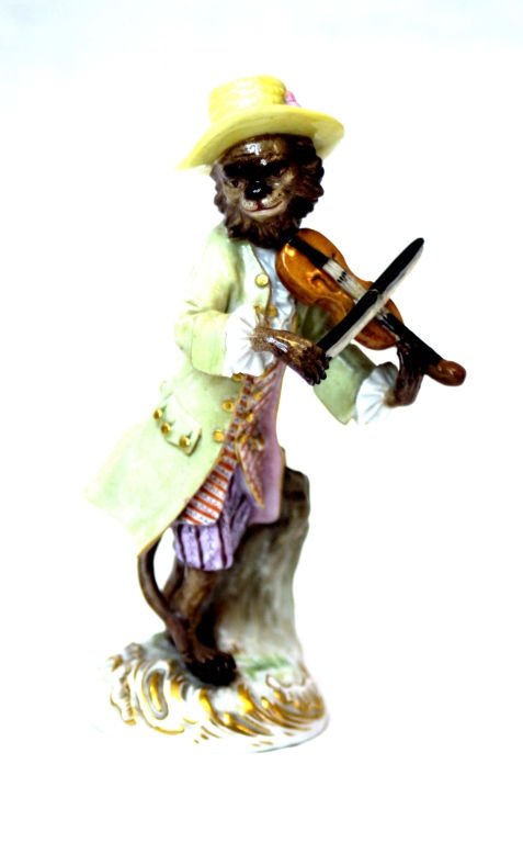 MEISSEN MONKEY VIOLIN PLAYER: Meissen Monkey Violin Player measures 5 1/2" Tall Vilolin's Bow has been repaired. Beautiful Antique 19th Century Meissen has Meissen Crossed Swords on Bottom.