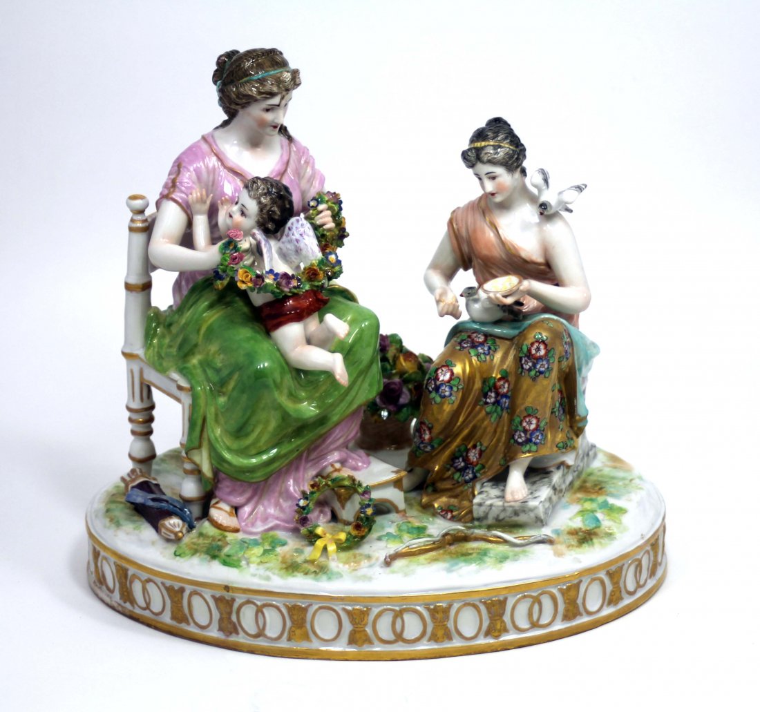 MEISSEN PORCELAIN GROUP: Depicts Woman sitting on Chair holding small Angel with Wings while the other Lady is sitting on Bench feeding Birds. Measures 10" Long by 6" Wide by 9" Tall. Incredible Hand Painted Colors.
