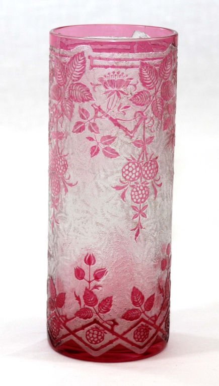 ANTIQUE BACCARAT CRANBERRY GLASS FLORAL VASE: Cylinder Shaped Baccarat Rose Colored Glass Pinapple Themed design with Leafs and Branches. Measures 8" Tall by 2 1/2" Diameter. Comes with Baccarat logo on bottom. Vase dates to the Early 1900's.