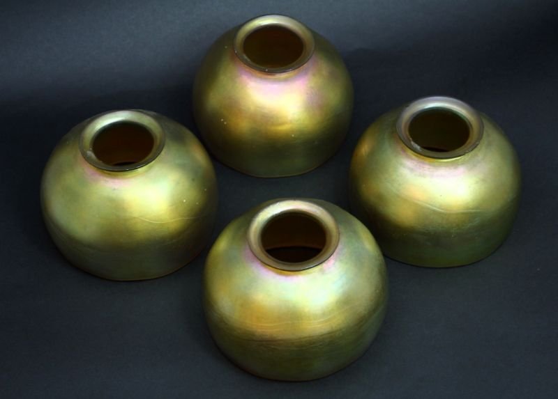 4 STEUBEN AURENE LAMP SHADES: Antique Iridescence Rose and Violet Colored Lamp Shades. With Fleur Steuben Logo on each Shade. Measures 3" Tall by 4 1/2" Diameter.