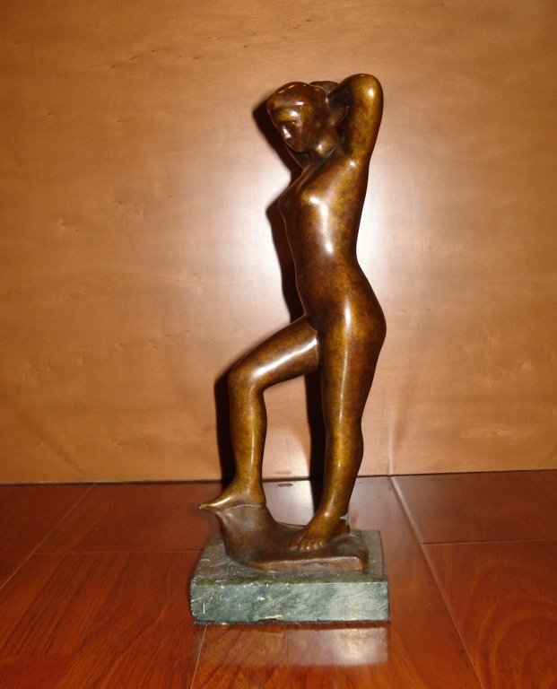 BRONZE SCULPTURE OF NUDE WOMAN ARISTIDE MAILLOL: French bronze sculpture with brown patina of nude woman after Aristide Maillol (1861 –1944). Stamped with Initial “M” Measures 11.5" Height