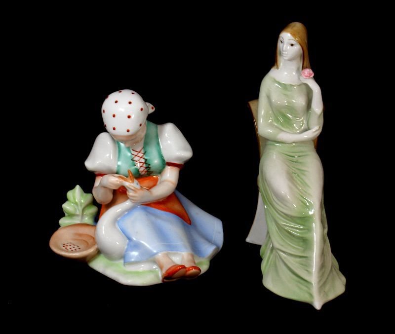 2 ZSOLNAY PORCELAIN HAND PAINTED FIGURINES: Seated Lady in Long Dress holding Flower, and Villager sitting down feeding Goose. Both are Stamped Zsolnay on Bottom.